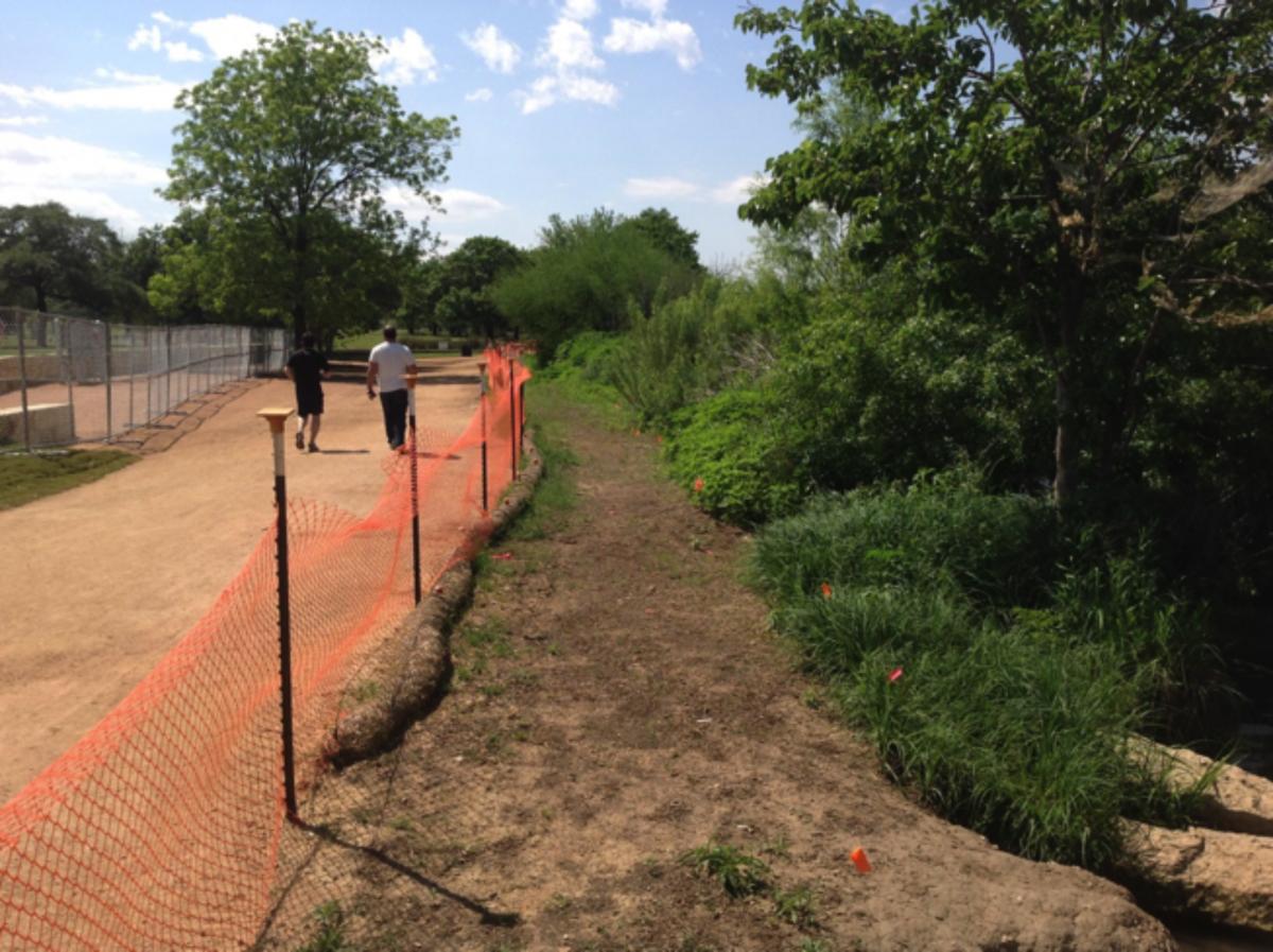 A fenced site; the soil was loosened up and the restoration began. 