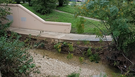 Photo showing erosion underneath the trail.