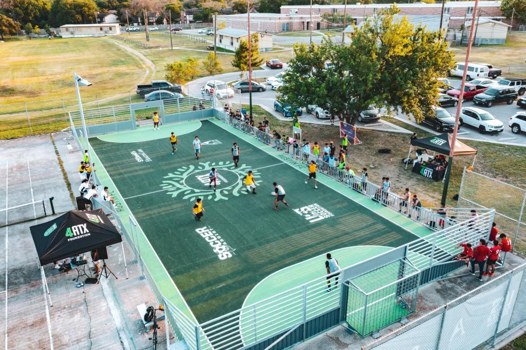 Soccer players face off at the Wooldridge School Park mini pitch.