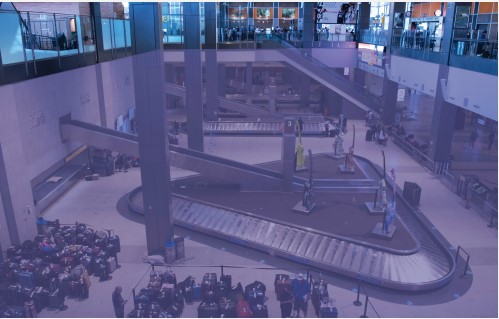 Atrium infill rendering depicts a purple transparent square above the open space on top of baggage claim