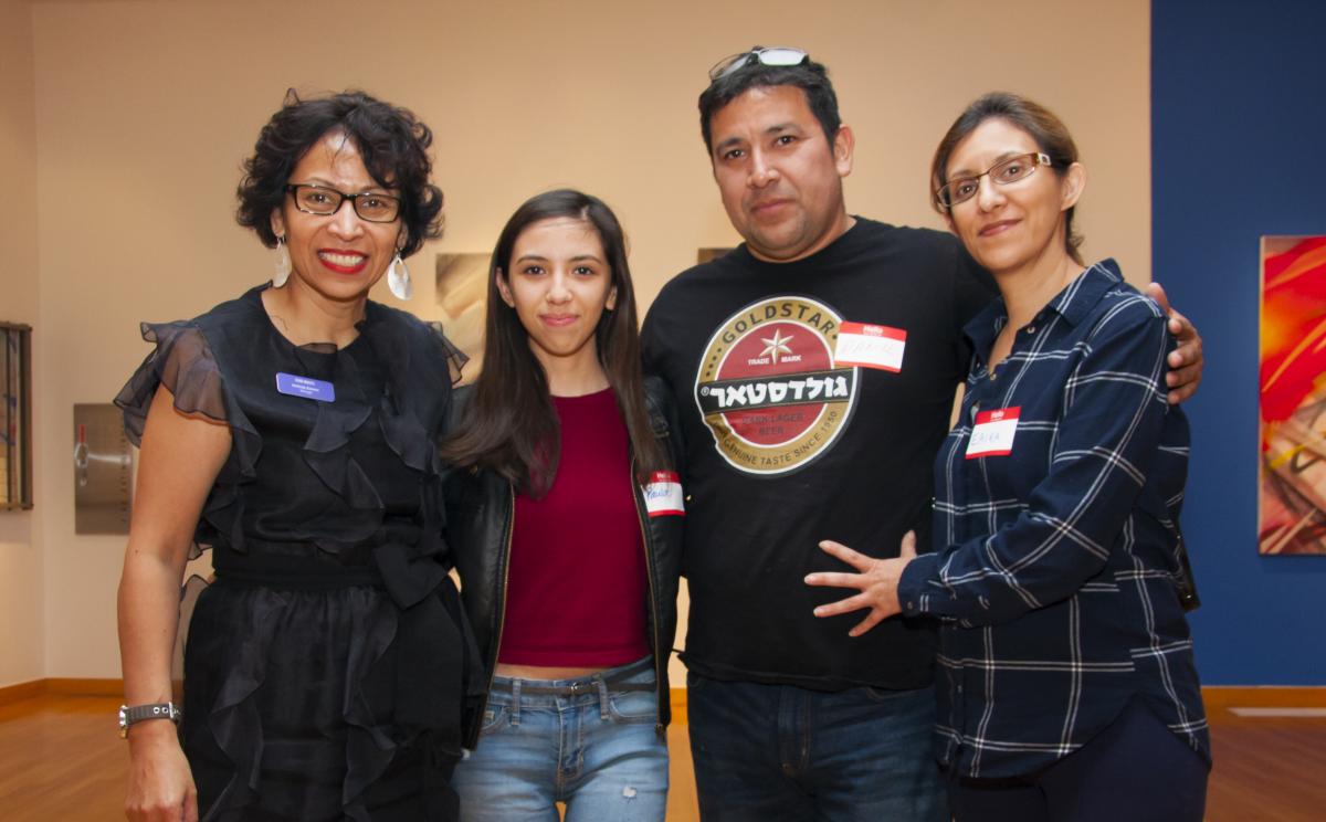 Herlinda Zamora of the ESB-MACC with a student and her family