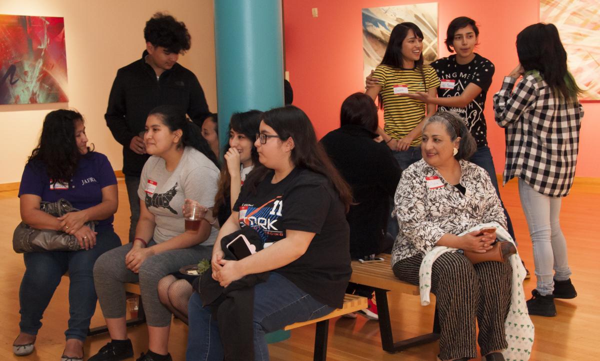 Students conversing at the reception