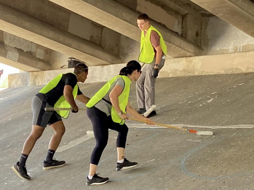 APD cadets cleaning an I35 underpass