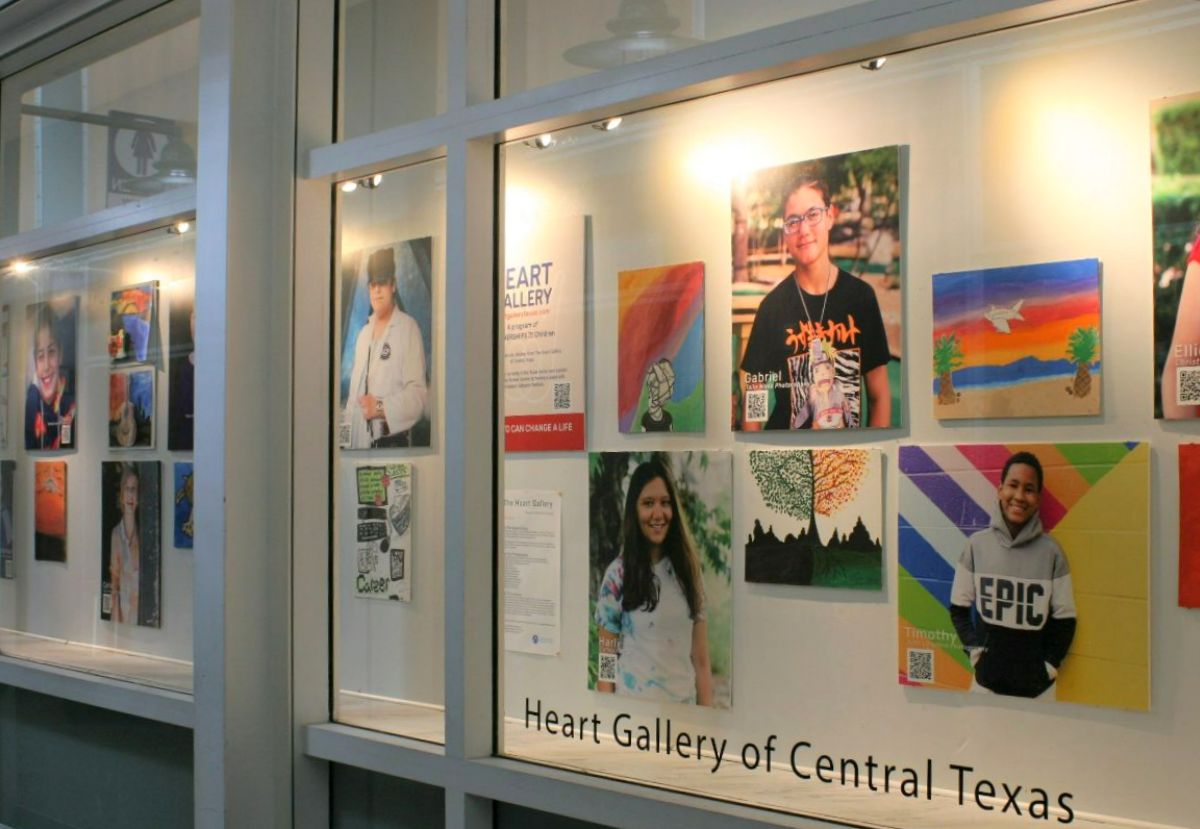 The Heart Gallery art installation at AUS features photo portraits of adoptable children next to their own original art work.