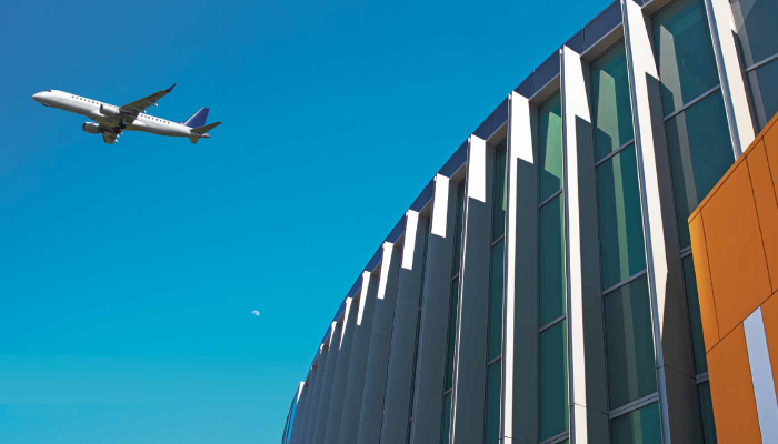 photo of plane flying over checkpoint 1 for landing page