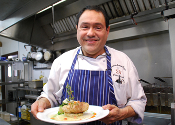 Man in kitchen smiling