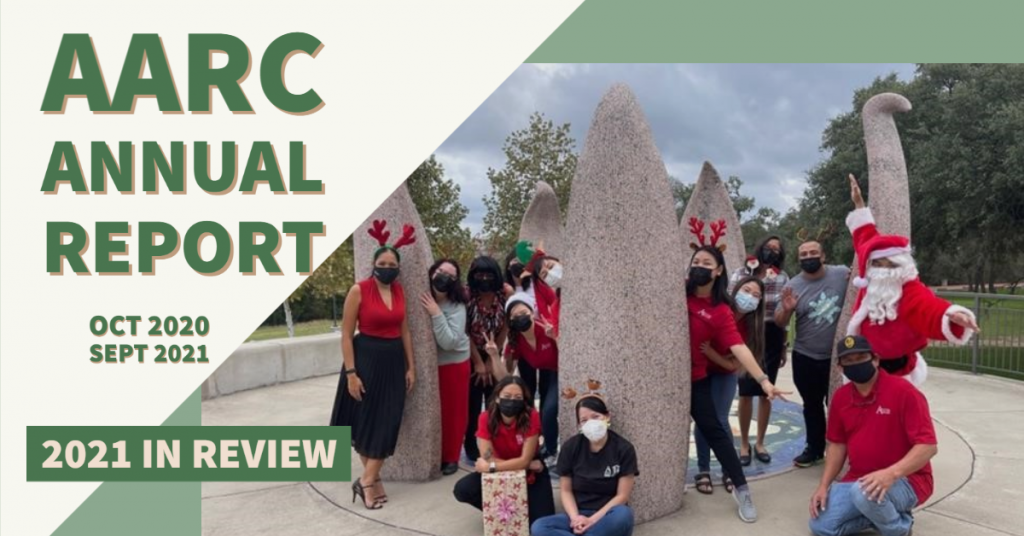 AARC Annual Report October 2020 - September 2021. 2021 in Review. AARC staff in festive outfits next to the lotus statue. 