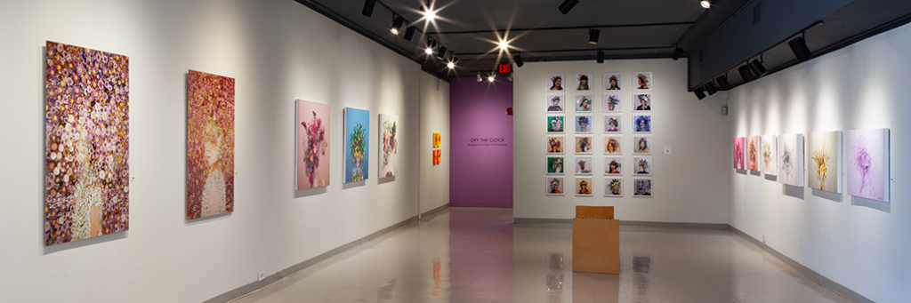 A gallery space with photographs on the walls