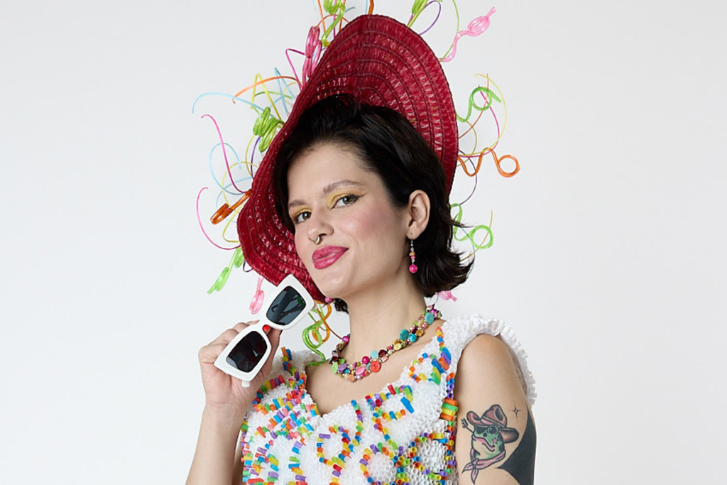 An image of a person dressed fashionably in an outfit made of cut up straws