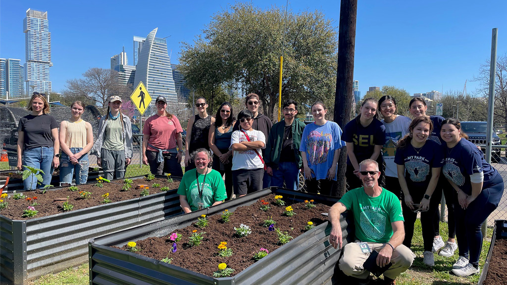 A group of people volunteering outside at the Dougherty Arts Center