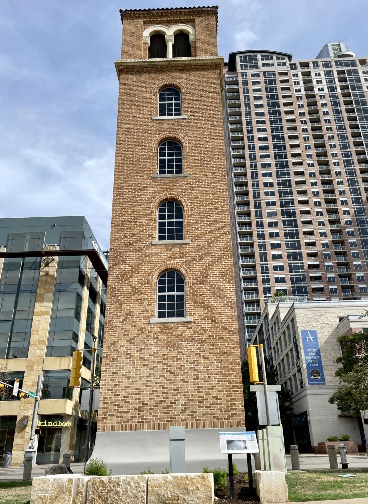 Image of Buford Tower after repairs, looking north with downtown buildings behind the tower