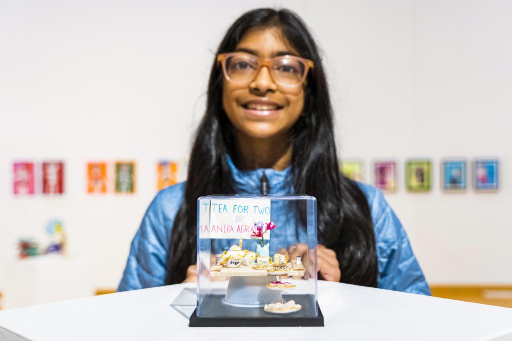 Photo of someone viewing the Figuralo Youth Exhibit 2021 in the Sam Coronado Gallery