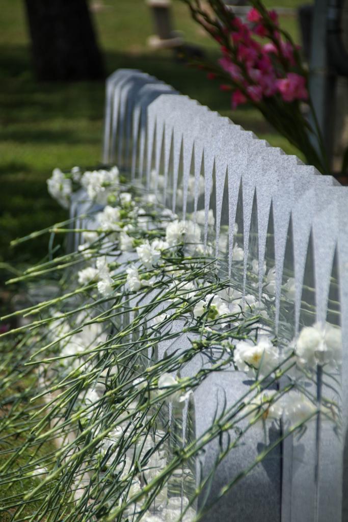 Image of memorial markers next to Oakwood Cemetery Chapel