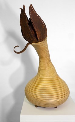 Birch wood sculptural vase featuring a steel flower blooming from the top