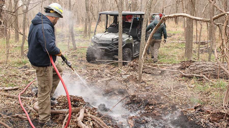 Crews extinguishing coals