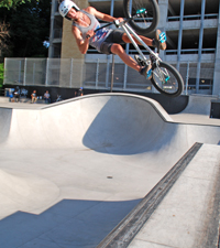 Person jumping a bike up a ramp