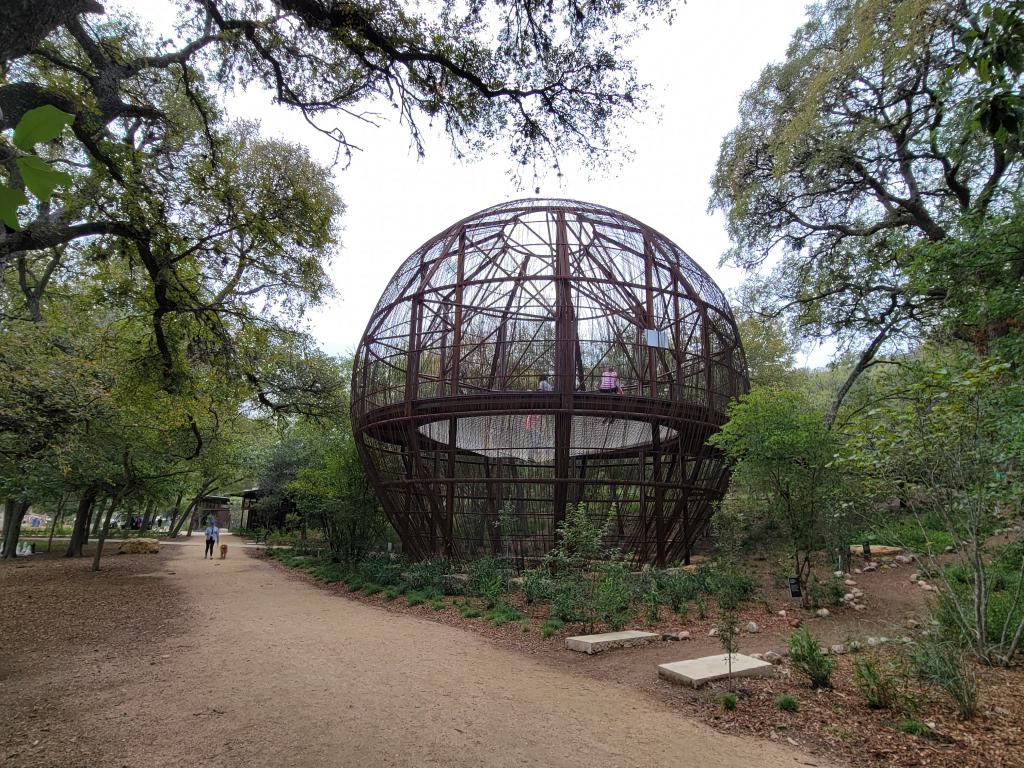 Image of large play structure along the trail at Pease Park