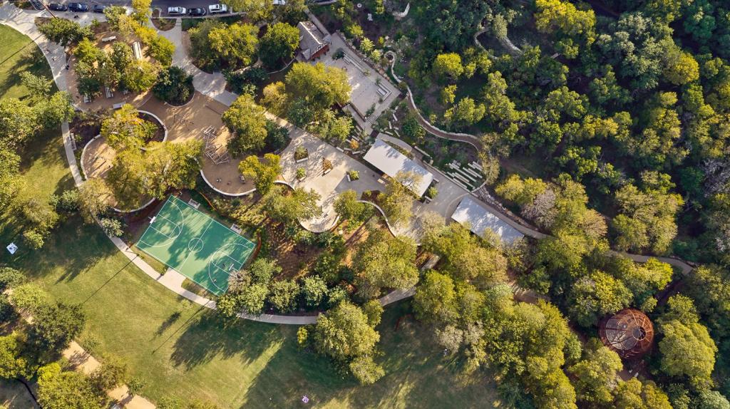 Overhead image of Pease Park showing trees, grass, basketball court, walking paths, and buildings