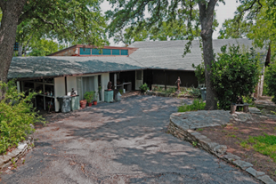 Image of house with trees around house