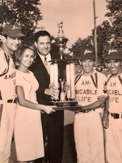 Image of Tony Castillo and teammates with Congressman J.J. Pickle receiving trophy, 1960s