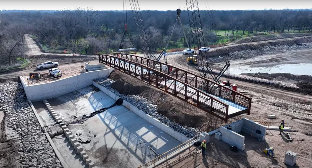 photo of placing new pedestrian bridge in construction