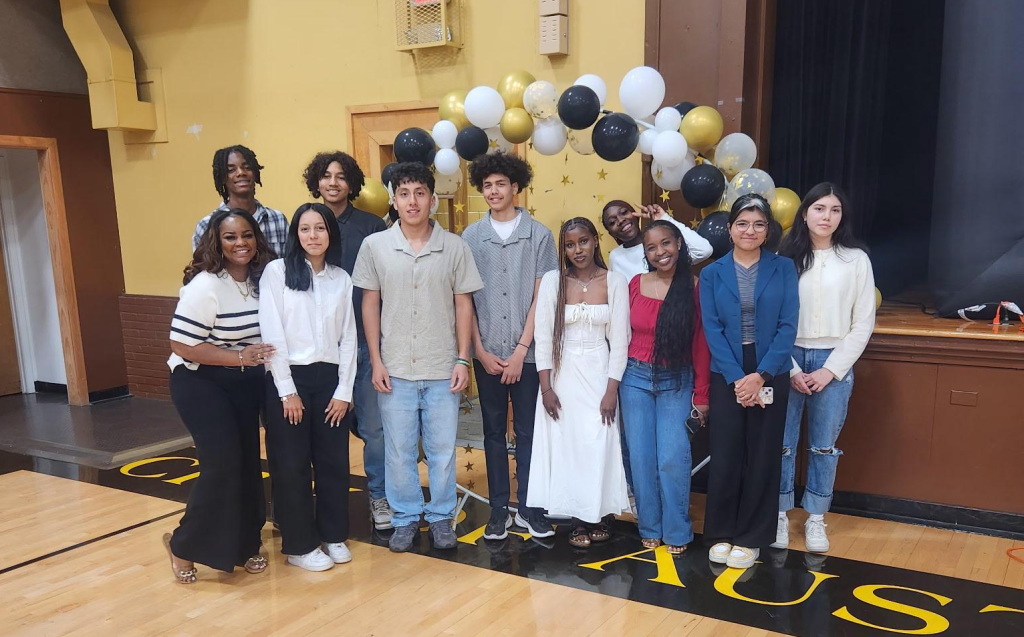 Participants posing for photo in graduation day