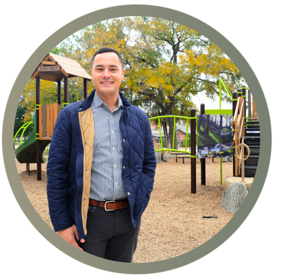 Andrew Cortes stands in front of a playscape at T.A. Brown.