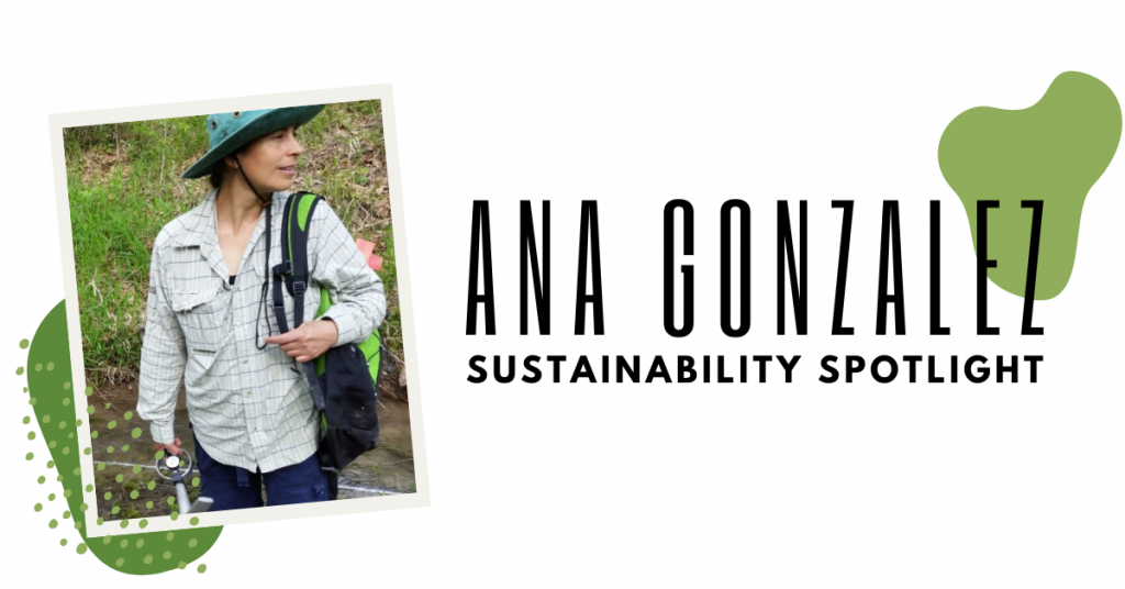 A photo of Ana Gonzalez wearing a backpack and a sunhat in a creek bed.