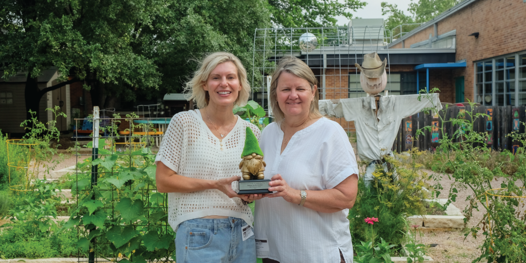 Abbey and Mary pose in the Zilker Elementary garden with the coveted Golden Gnome trophy.