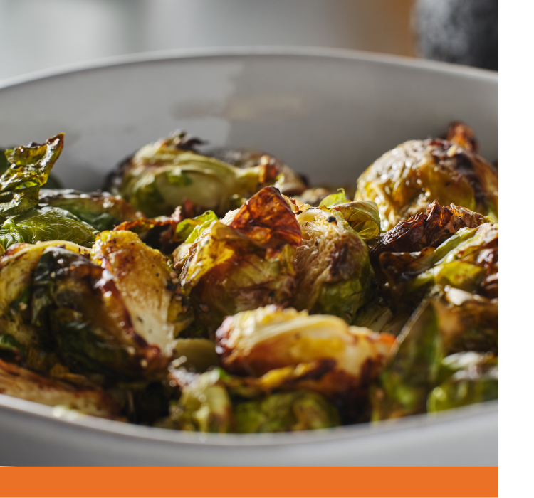 A bowl of roasted brussel sprouts.