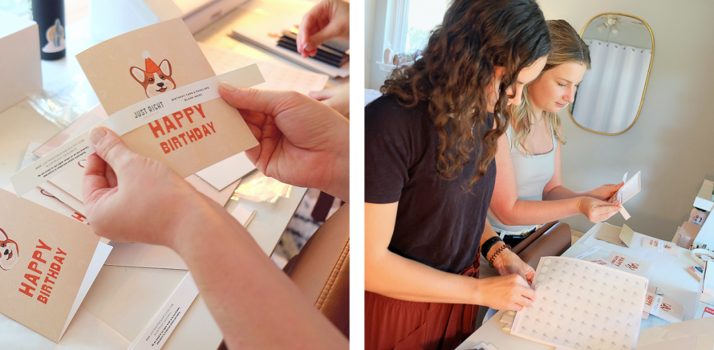 Claire and Ashleigh work on packaging greeting cards in recyclable belly bands.