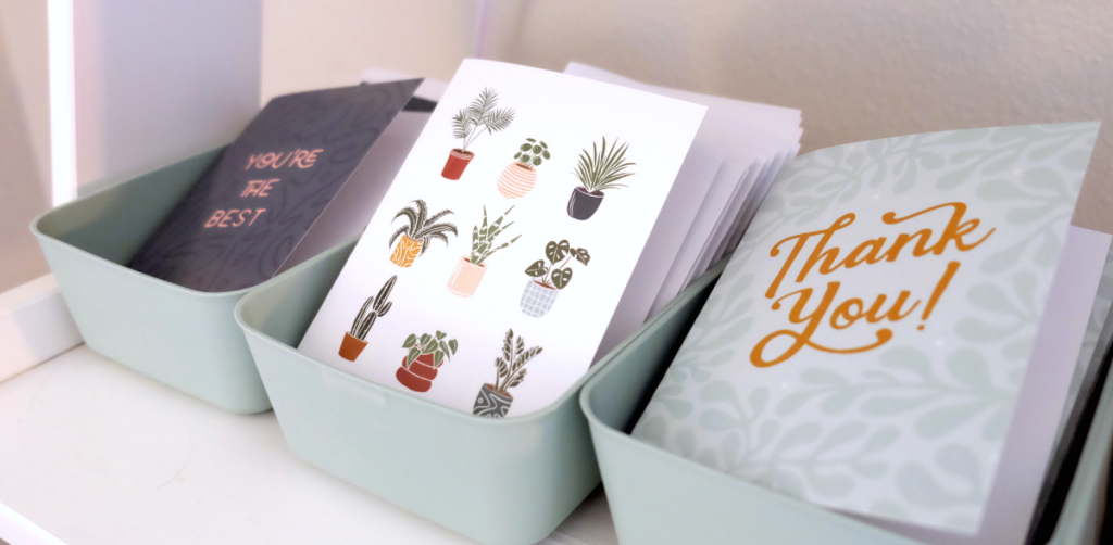 Illustrated greeting cards in small boxes.