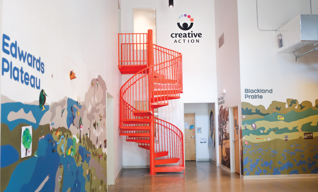 Sustainability art education mural in the foyer of the Creative Action building