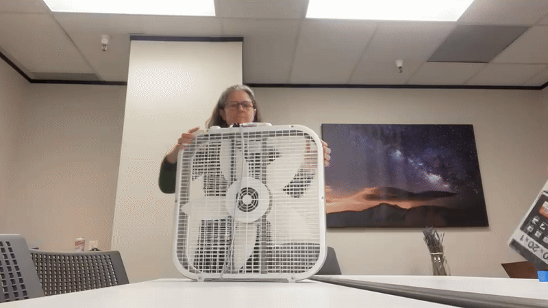 Gif/video of two of our team members assembling an air filter.