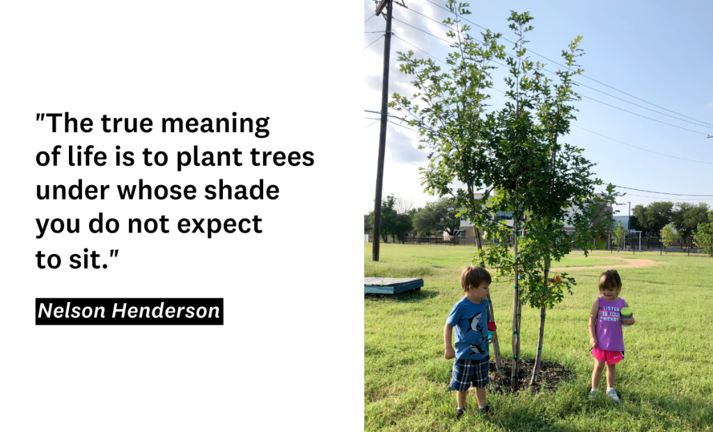 Andrew's twins stand beneath one of the trees planted by his family.