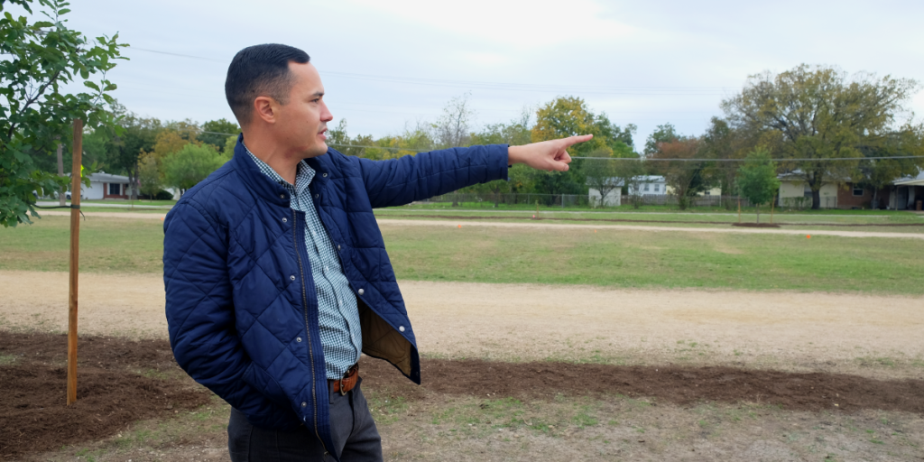 Andrew points to a space on campus in the distance.