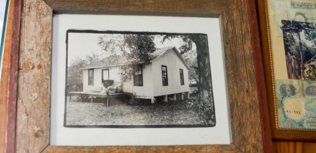A historical photo of Thor's home in a wood frame.