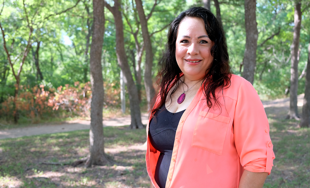 Frances smiles outside at Williamson Creek Greenbelt.