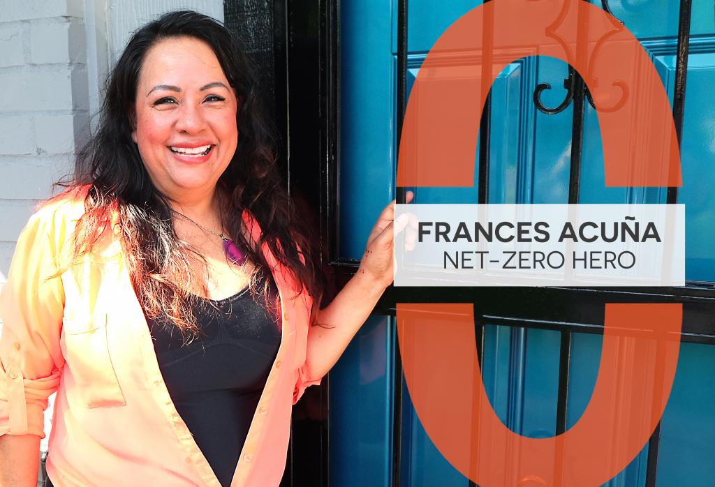 Frances stands in front of a bright teal door.