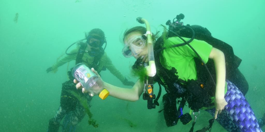  Scouts from Troop 40348 pick up trash from Lake Travis during a dive.