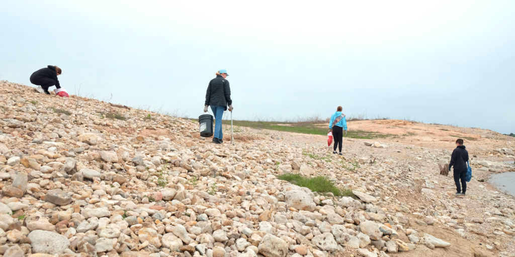 Scouts scour the shoreline for trash and debris.