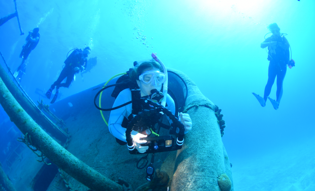 Scouts practice how to safely take underwater photographs.