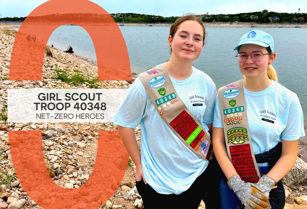 Eleanor and Summer stand in front of Lake Austin in their Girl Scout sashes.