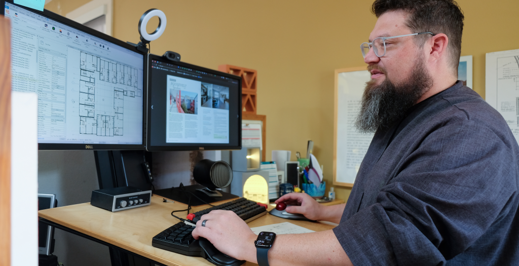 Jason working in their office.