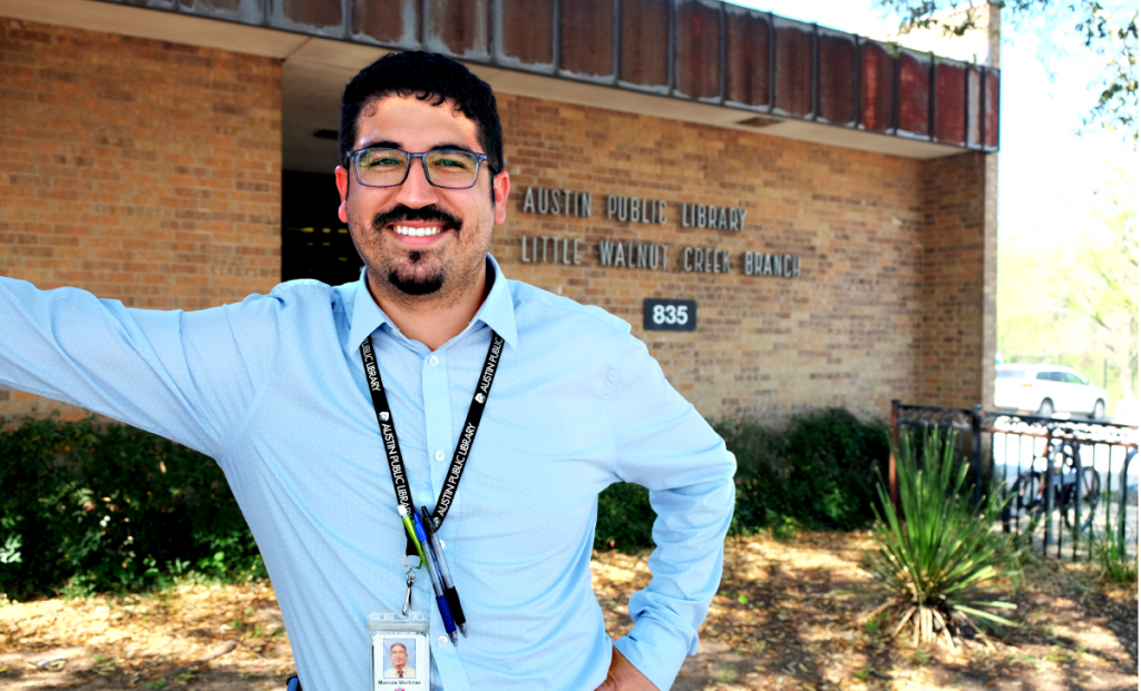 A photo of Marcos smiling outside the Little Walnut Creek Branch Library. 