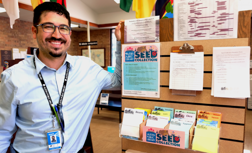 Marcos stands next to the seed collection.