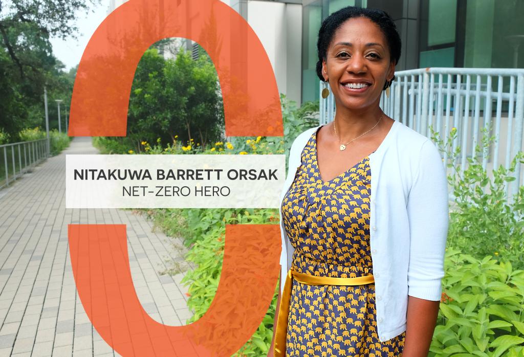 Nitakuwa Barratt Orsak stands on the Waller Creek Greenbelt smiling.