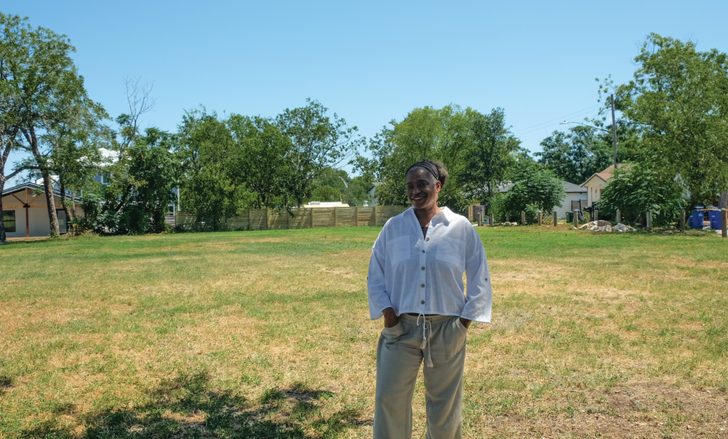 Warinda smiles in front of the empty pocket park.