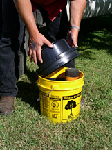 Replace the lid onto the bucket keeping the lip within the rim of the bucket to prevent drips.