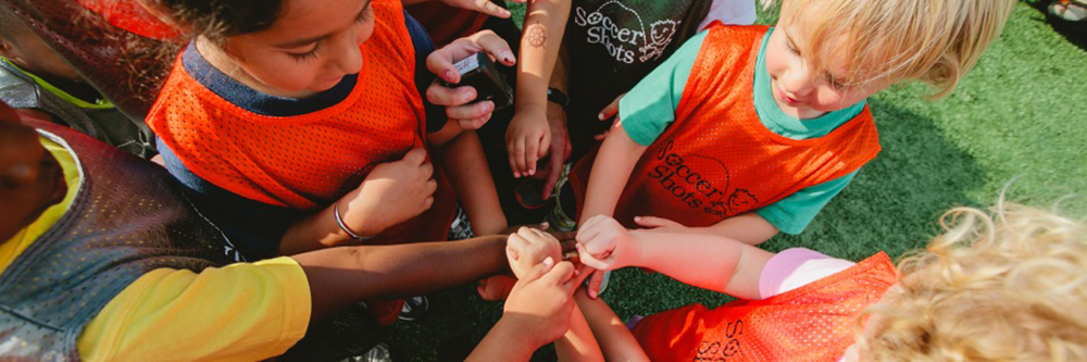 Kids celebrating after a winning a game.